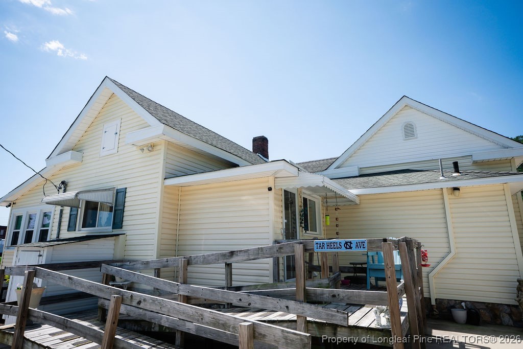 208 Thompson Street Fairmont, NC 28340 - Photo 17 of 19 a front view of a house with garage