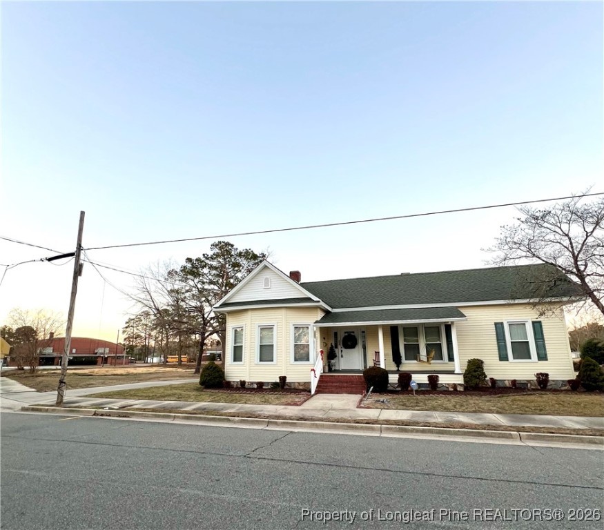 208 Thompson Street Fairmont, NC 28340 - Photo 18 of 19 a front view of a building with a parked car parked