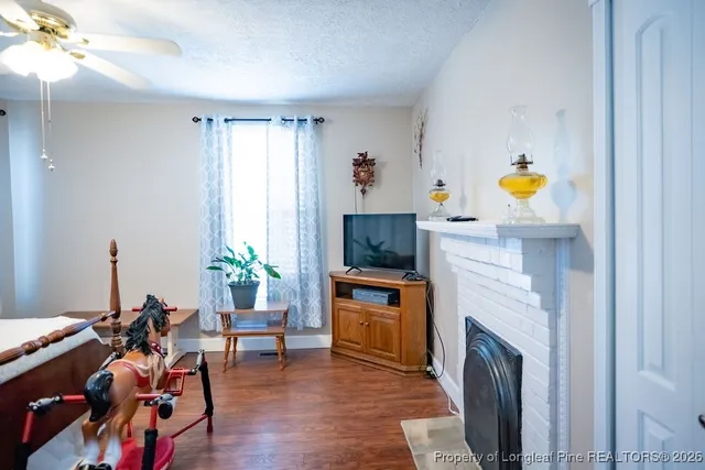 a living room with furniture and a fireplace