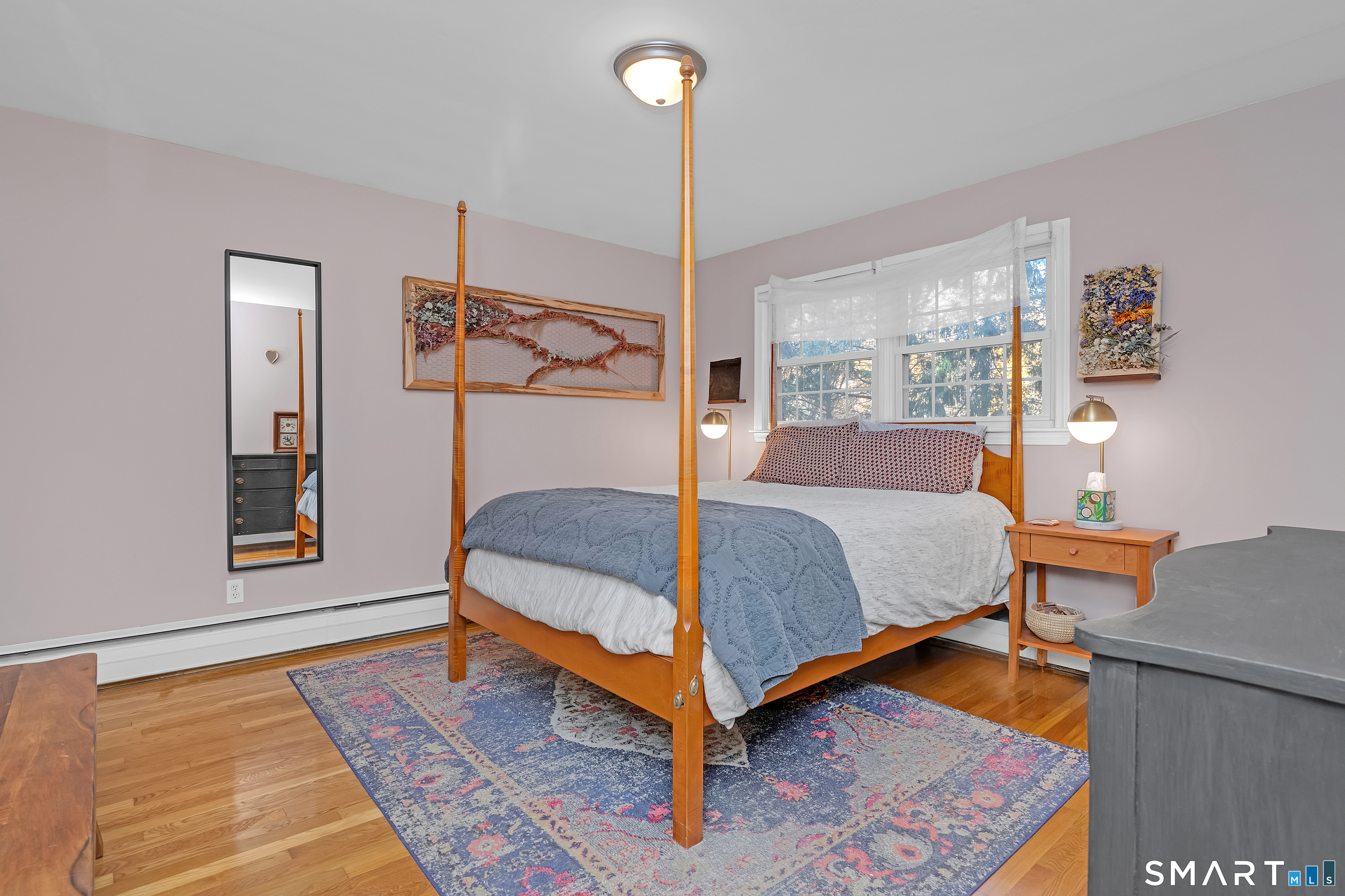 16 Marion Road Bethany, CT 06524 - Photo 19 of 40 a bedroom with a bed and wooden floor