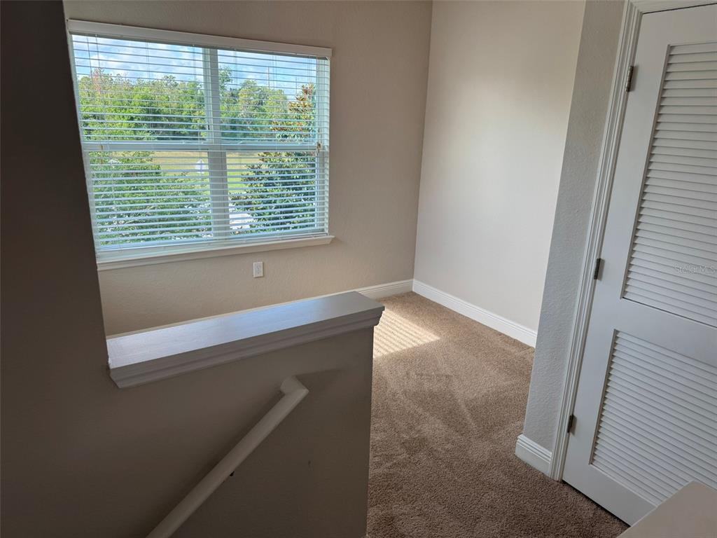 2420 Ann Rou Road, Unit 201 Tavares, FL 32778 - Photo 22 of 25 a bathroom with a window