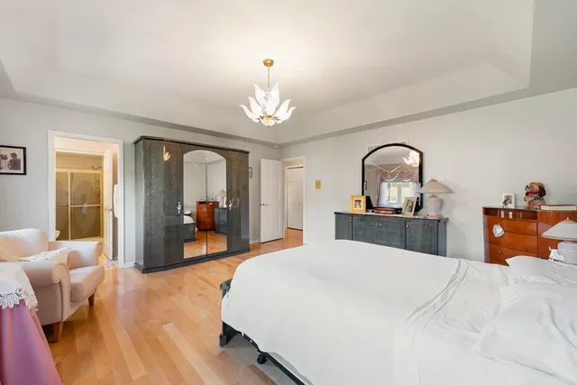 a bed room with a bed and a mirror