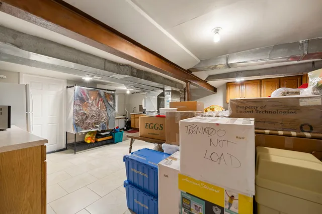 a kitchen with a stove sink and cabinets