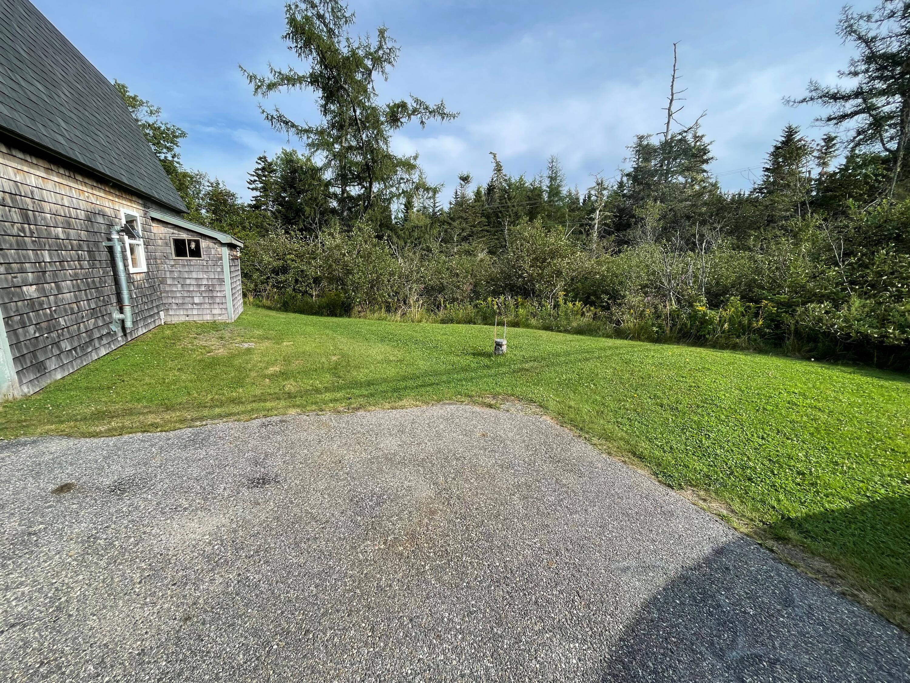 1440 Cutler Road Cutler, ME 04626 - Photo 7 of 23 1440 SIDE YARD WITH WELL