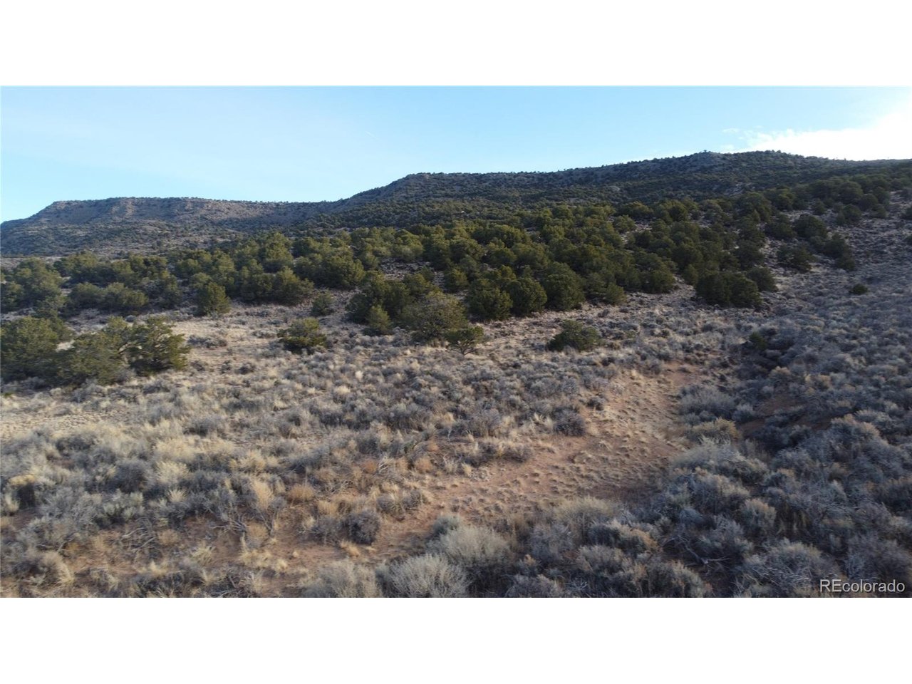 54 Old Stage Coach Road San Luis, CO 81152 - Photo 19 of 20 a open area with mountains in the background