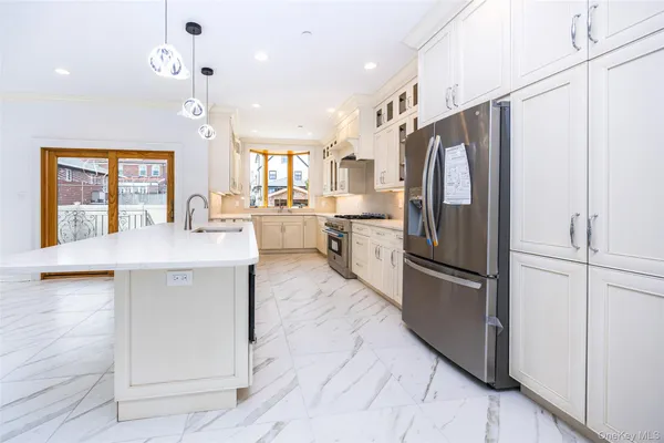 a kitchen with refrigerator cabinets and furniture