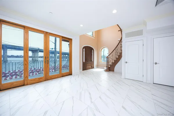 a view of an entryway with wooden floor