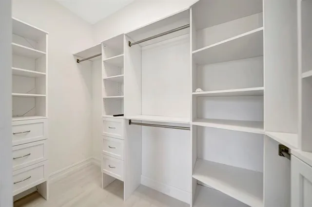 a view of an empty walk in closet