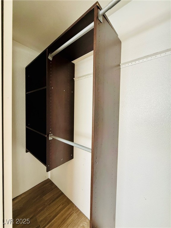 2750 South Durango Drive, Unit 2010 Las Vegas, NV 89117 - Photo 13 of 31 Spacious closet with dark wood finished floors