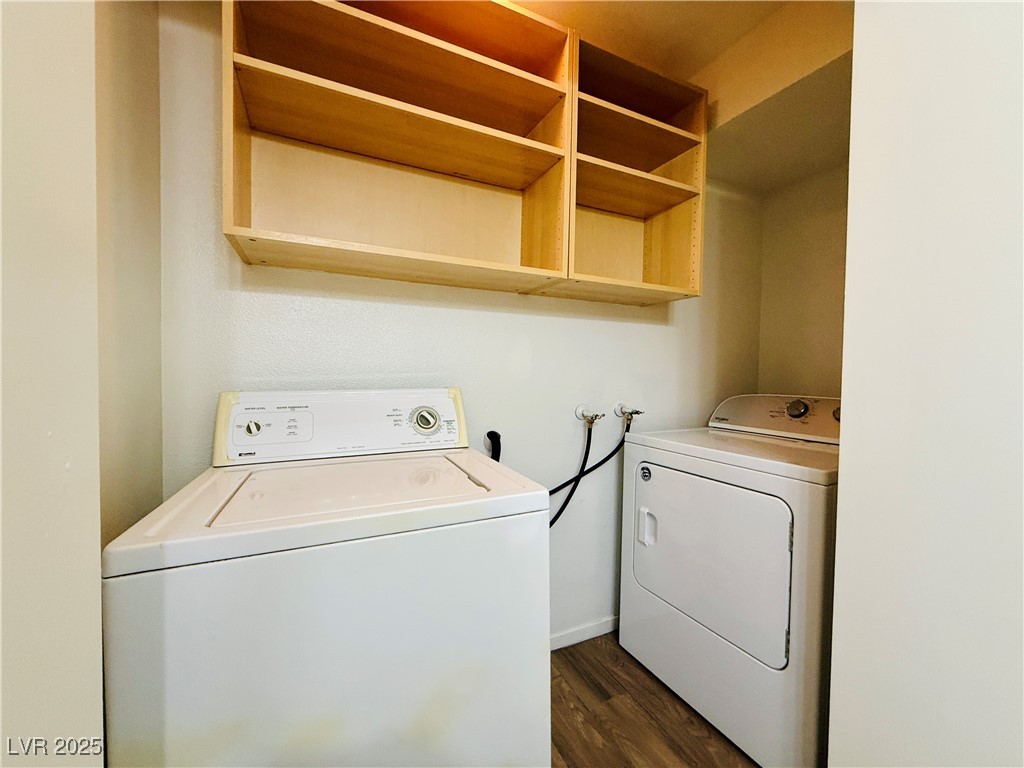 2750 South Durango Drive, Unit 2010 Las Vegas, NV 89117 - Photo 22 of 31 Washroom featuring dark wood-type flooring and separate washer and dryer