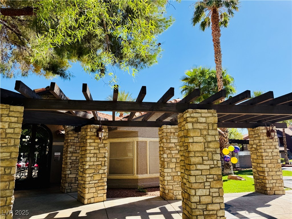 2750 South Durango Drive, Unit 2010 Las Vegas, NV 89117 - Photo 29 of 31 View of patio featuring a pergola