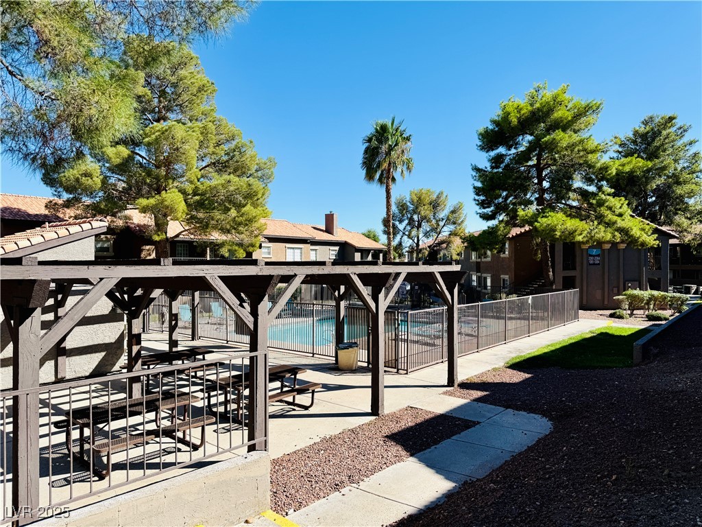 2750 South Durango Drive, Unit 2010 Las Vegas, NV 89117 - Photo 30 of 31 View of community featuring a patio and a pool