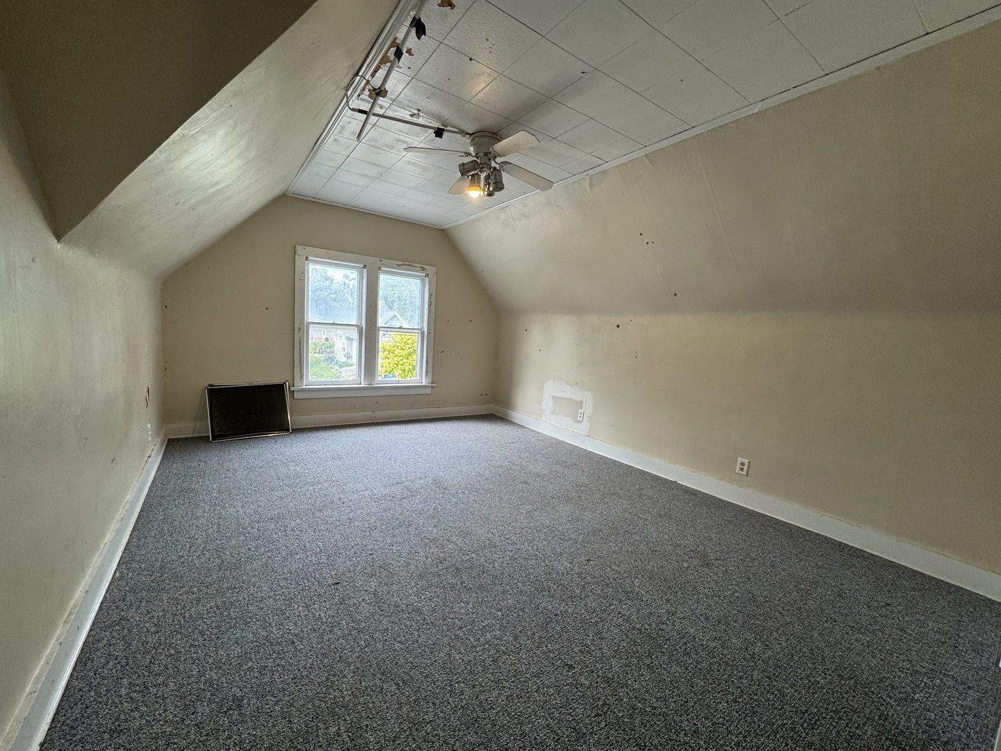 734 West Henry Street Pontiac, IL 61764 - Photo 11 of 17 wooden floor in an empty room with a window
