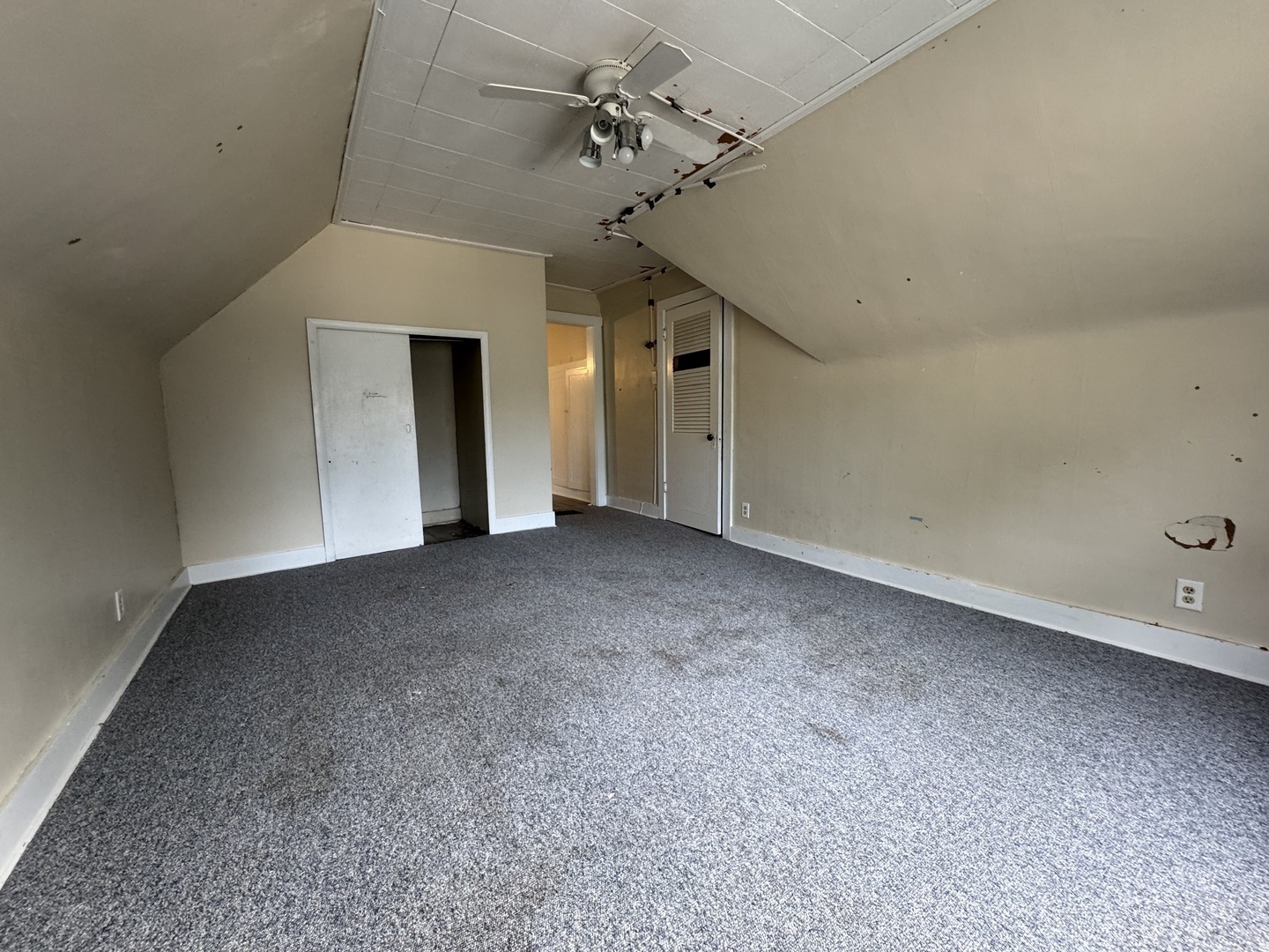 734 West Henry Street Pontiac, IL 61764 - Photo 12 of 17 a view of a big room with chandelier fan
