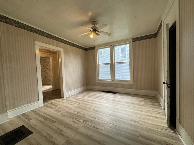 a view of an empty room with a window