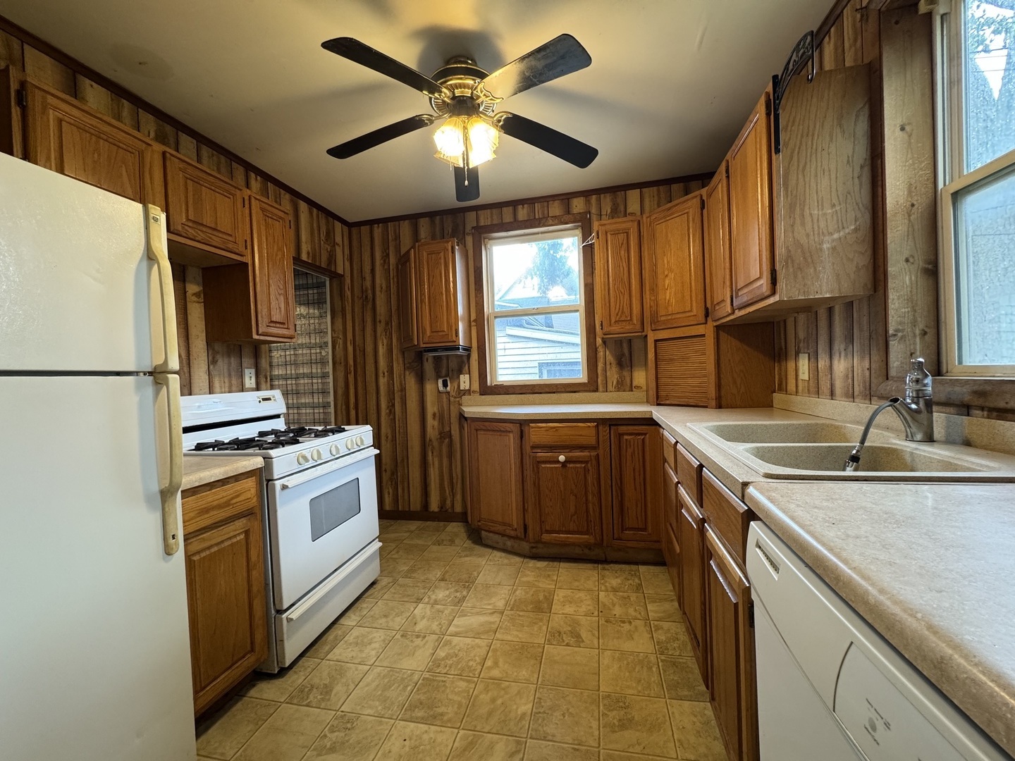 734 West Henry Street Pontiac, IL 61764 - Photo 10 of 17 a kitchen with stainless steel appliances granite countertop a sink stove and refrigerator