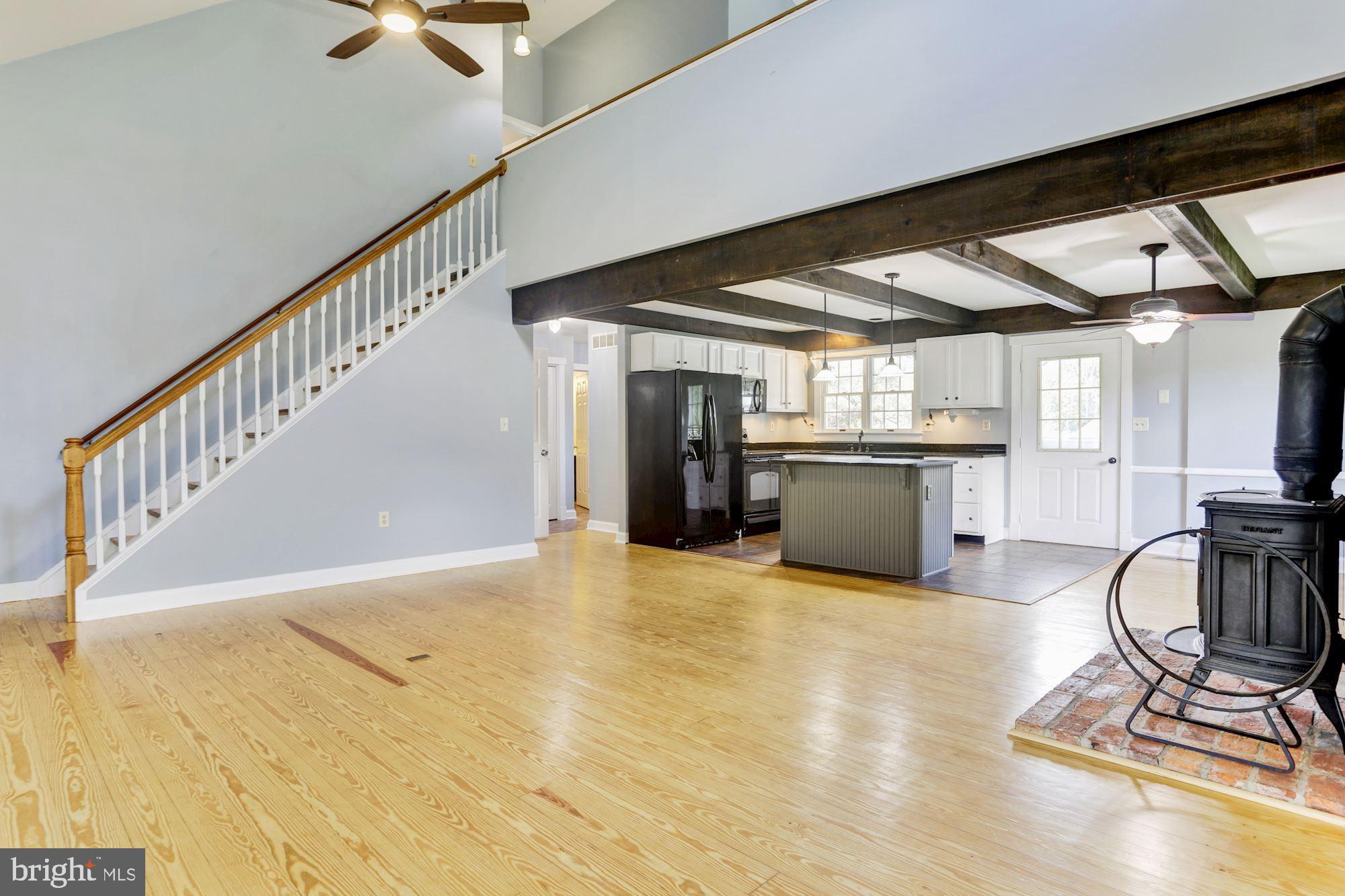 2612 Deer Park Road Finksburg, MD 21048 - Photo 2 of 53 Living Room | Pine Floors | Exposed Beams