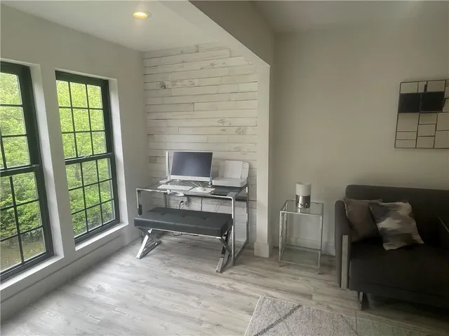 a workspace with furniture and a window