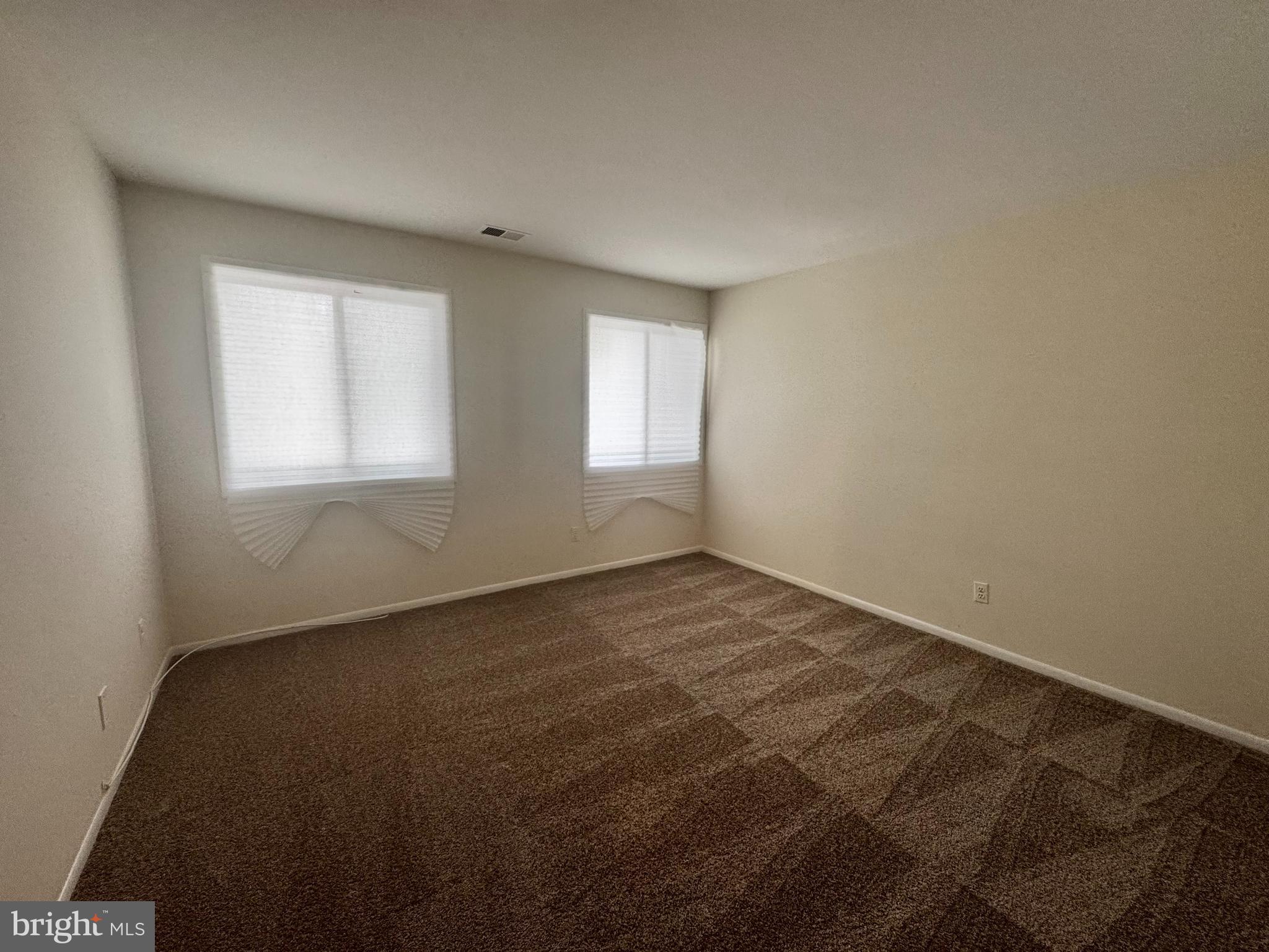 8 Winners Circle, Unit 2B Owings Mills, MD 21117 - Photo 7 of 14 an empty room with a window