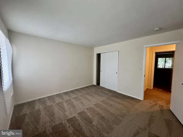 a view of an empty room and window