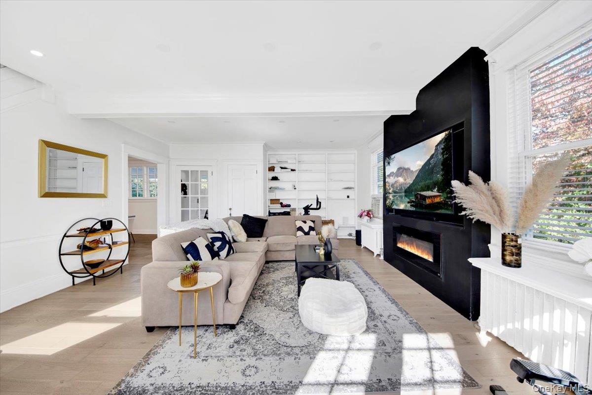 1 Slocum Street New Rochelle, NY 10801 - Photo 19 of 49 a living room with furniture and a fireplace