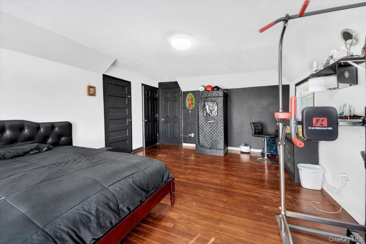 1 Slocum Street New Rochelle, NY 10801 - Photo 22 of 49 a spacious bedroom with a bed and a walk in closet