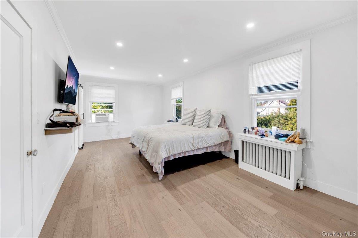 1 Slocum Street New Rochelle, NY 10801 - Photo 27 of 49 a bedroom with a bed and a window