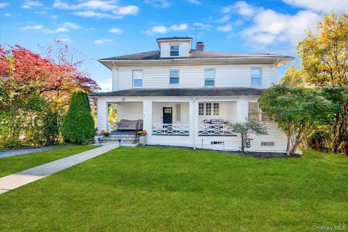 1 Slocum Street New Rochelle, NY 10801 - Photo 3 of 49 a front view of a house with a garden