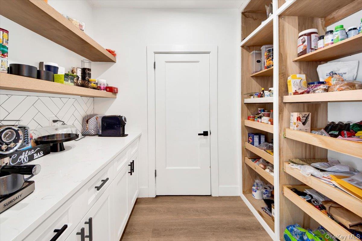 1 Slocum Street New Rochelle, NY 10801 - Photo 10 of 49 a view of kitchen with stainless steel appliances cabinets and book shelf