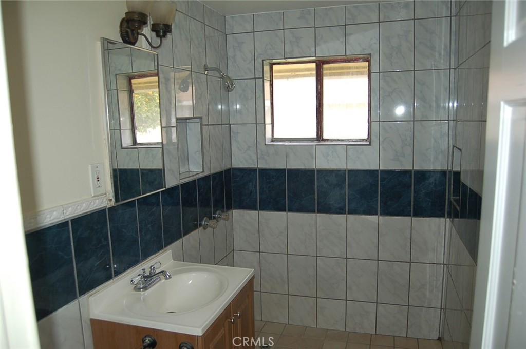 8343 Trey Avenue, Unit A Riverside, CA 92503 - Photo 11 of 17 a bathroom with a sink and a mirror