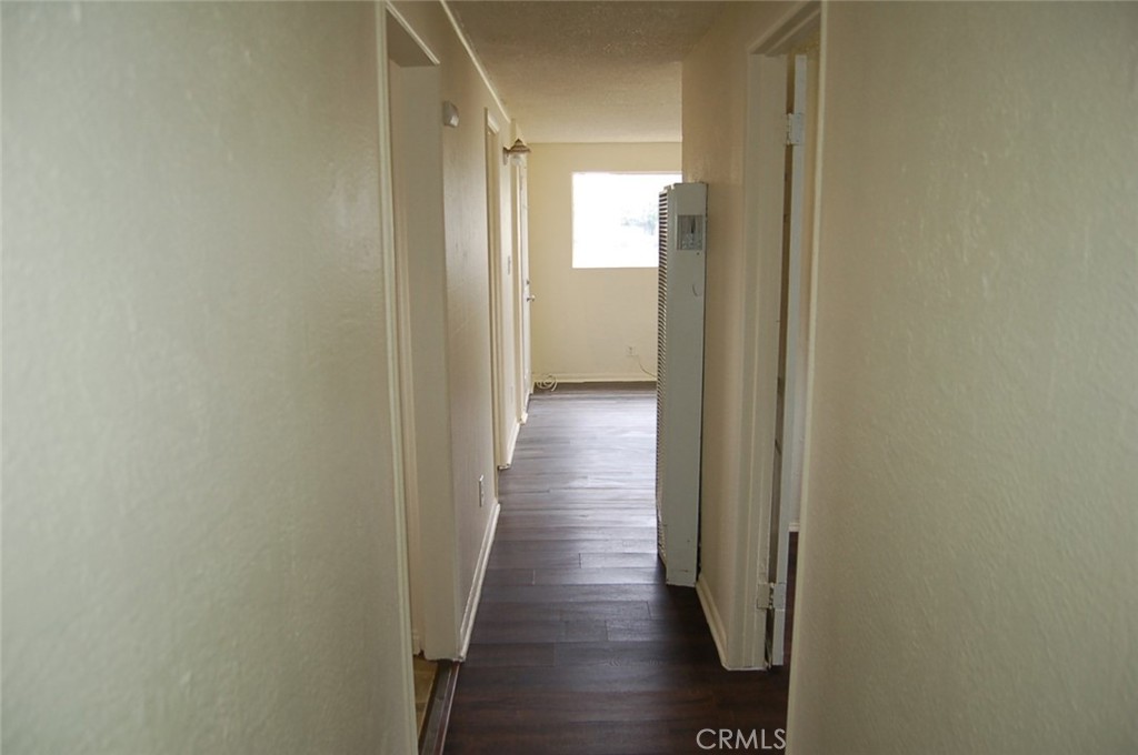 8343 Trey Avenue, Unit A Riverside, CA 92503 - Photo 17 of 17 a view of a hallway with wooden floor