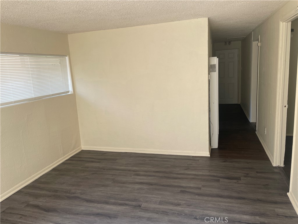 8343 Trey Avenue, Unit A Riverside, CA 92503 - Photo 7 of 17 a view of an empty room with wooden floor