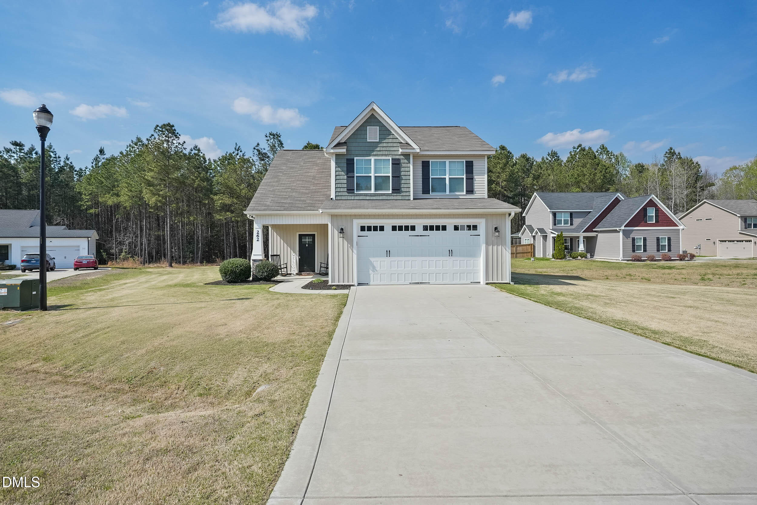 262 Day Lily Street Selma, NC 27576 - Photo 15 of 39 a front view of a house with a yard
