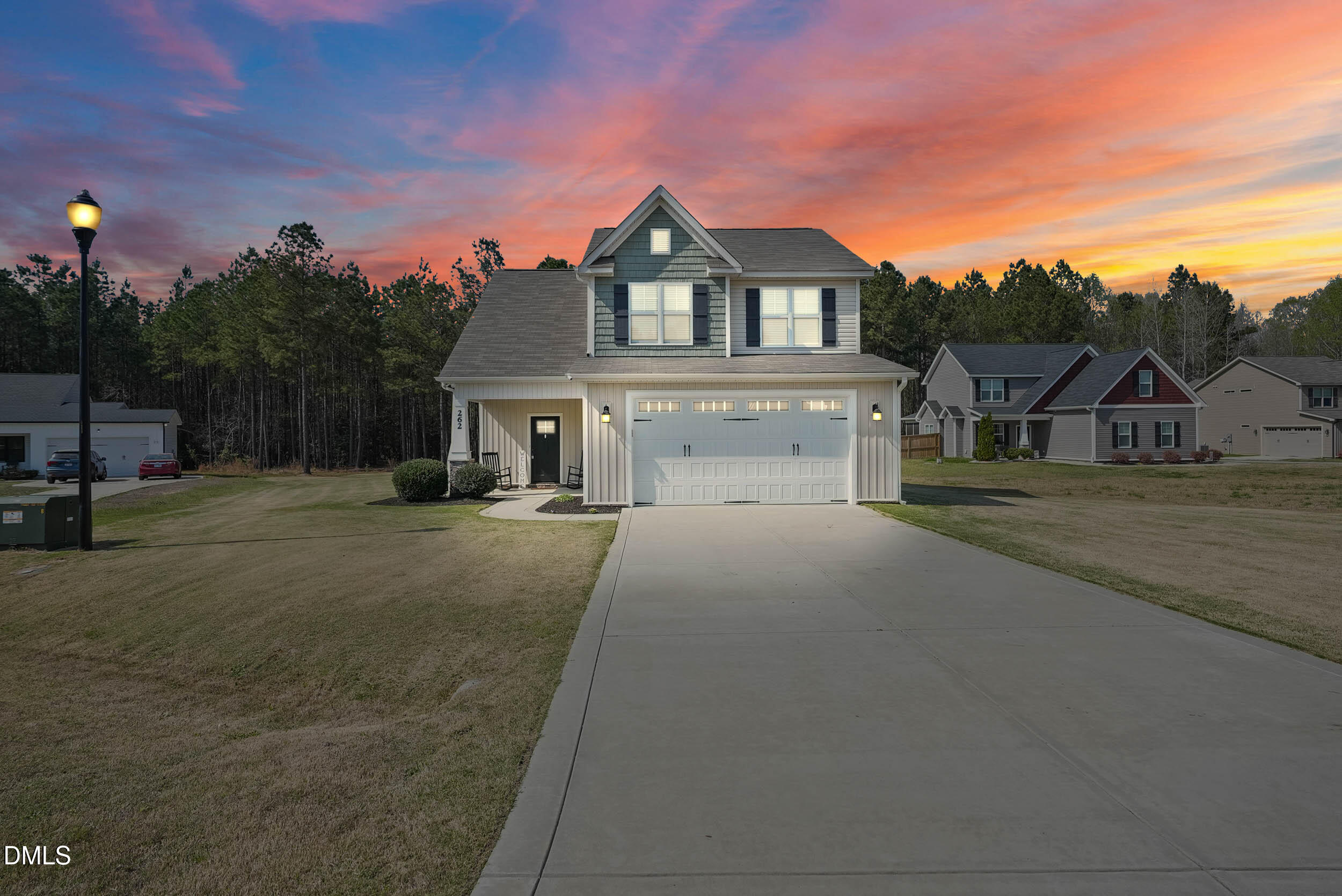 262 Day Lily Street Selma, NC 27576 - Photo 2 of 39 a front view of a house with a yard and garage