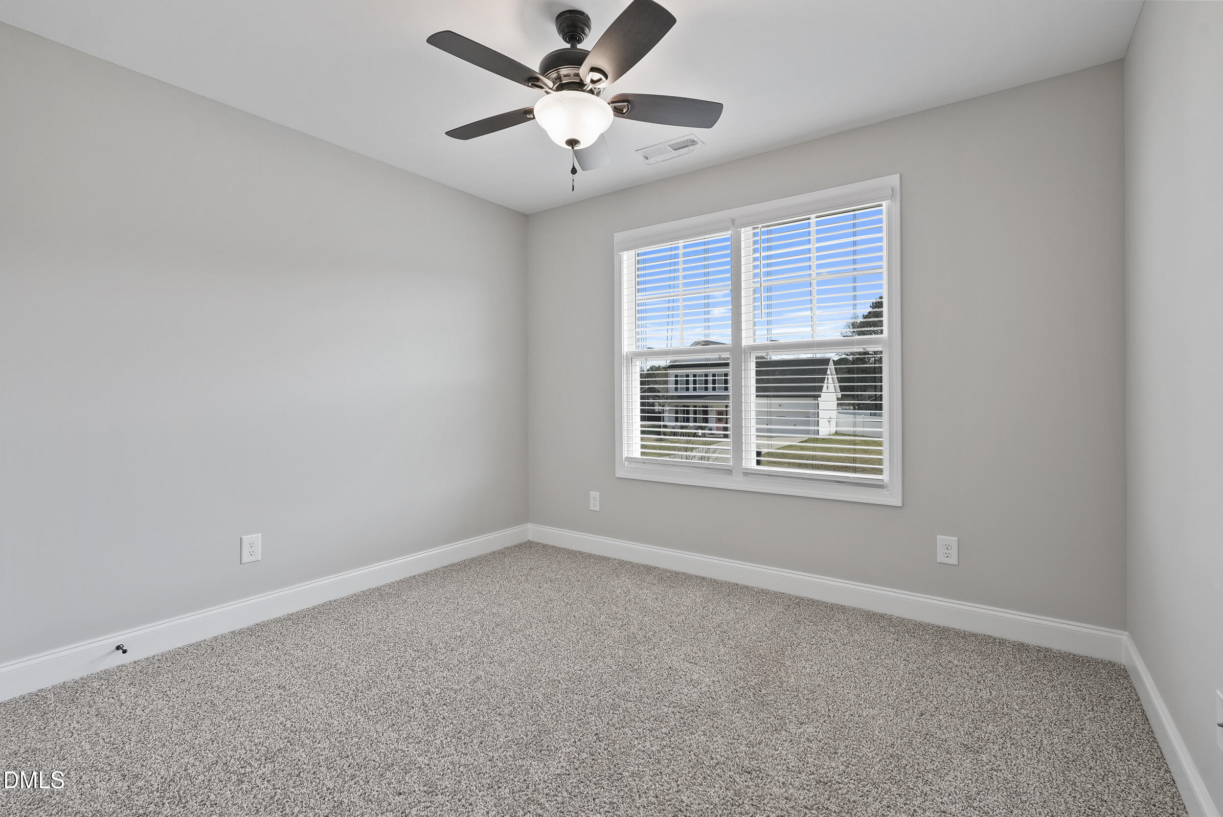 262 Day Lily Street Selma, NC 27576 - Photo 21 of 39 a view of an empty room with a window