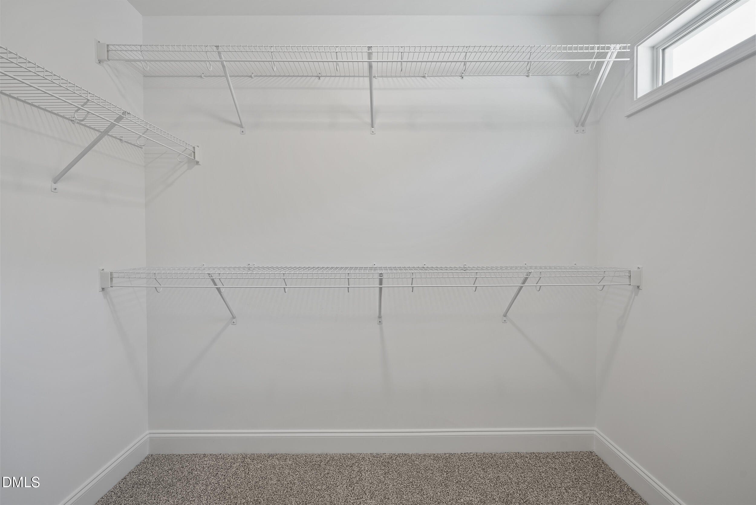 262 Day Lily Street Selma, NC 27576 - Photo 25 of 39 a view of a room with racks on the wall