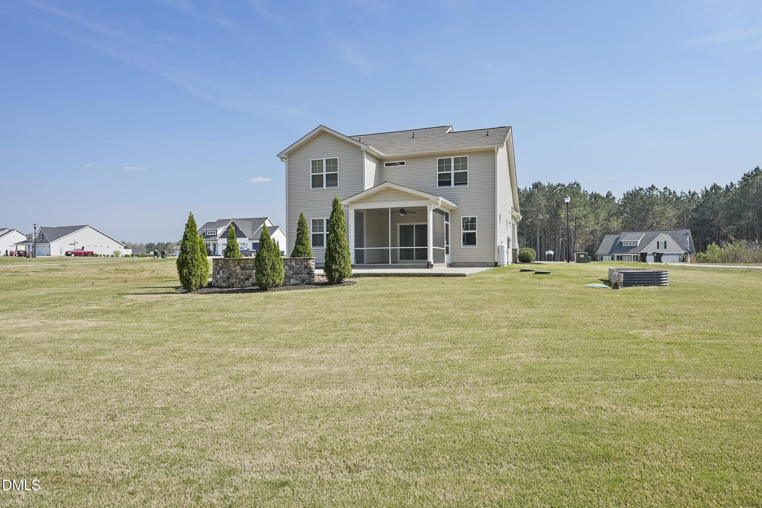 262 Day Lily Street Selma, NC 27576 - Photo 31 of 39 a front view of a house with a garden