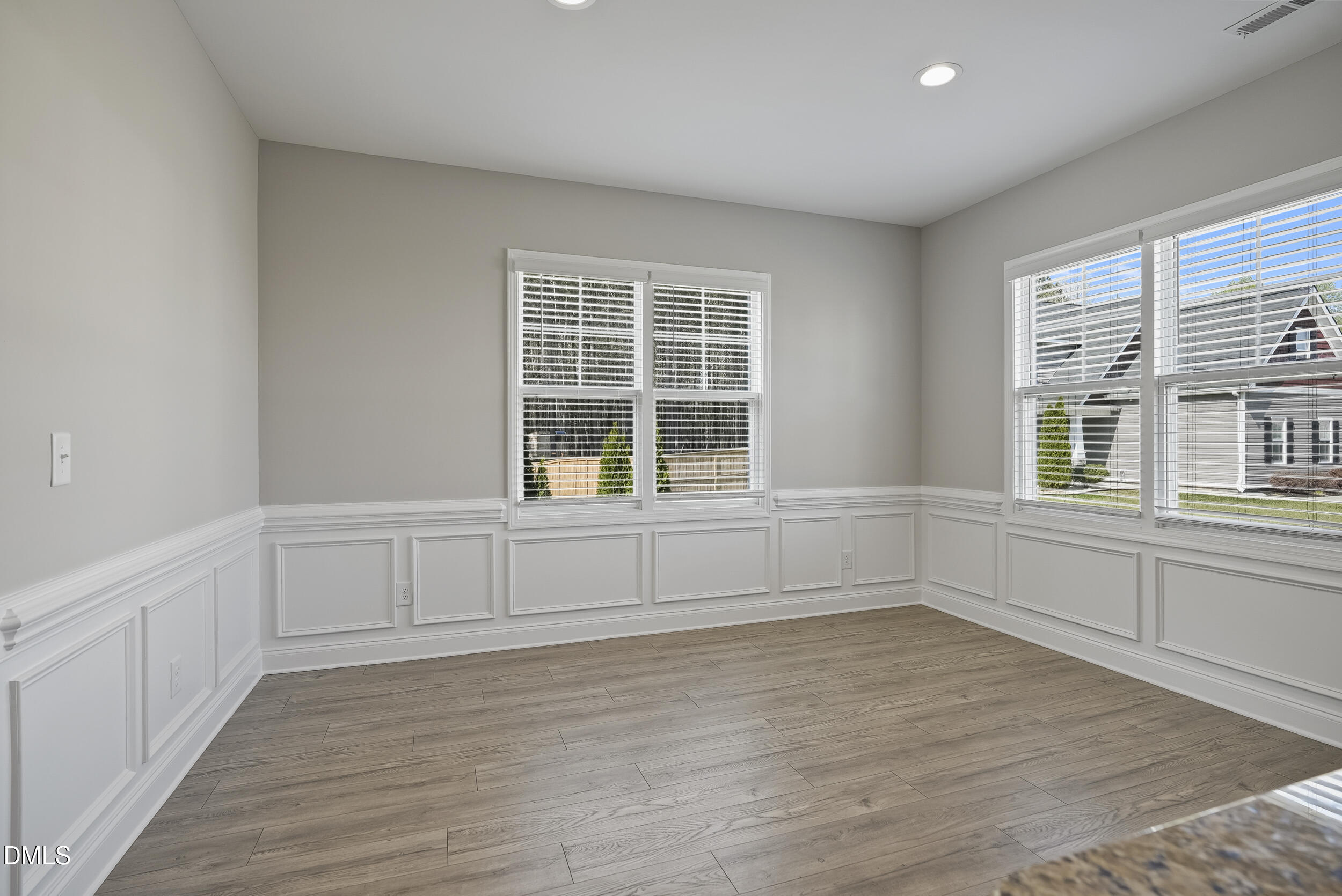 262 Day Lily Street Selma, NC 27576 - Photo 38 of 39 wooden floor in an empty room with a window