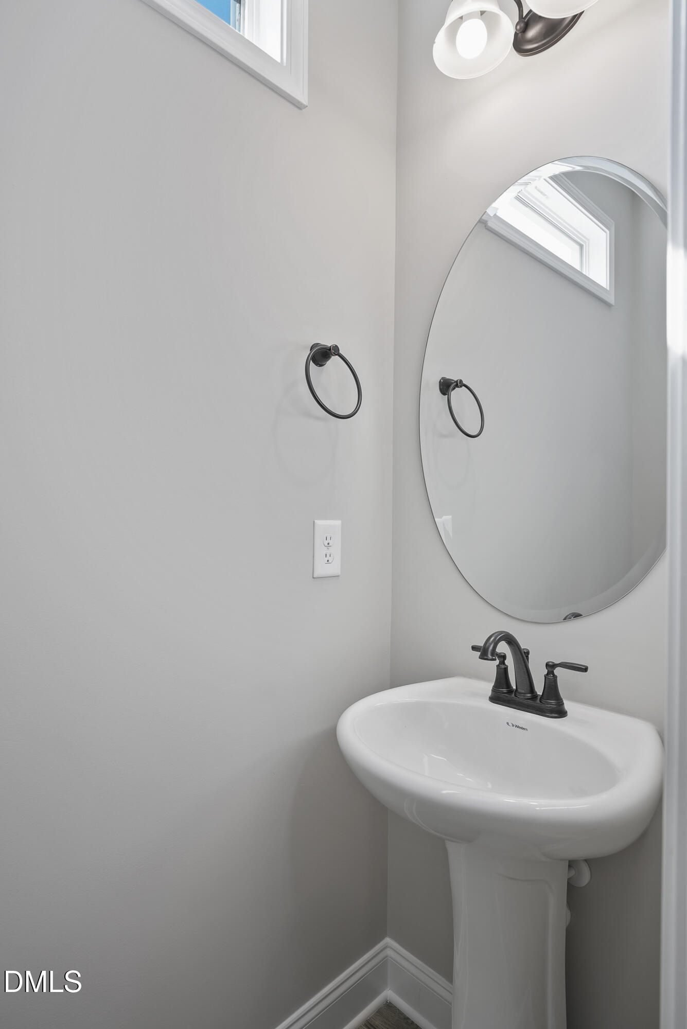262 Day Lily Street Selma, NC 27576 - Photo 4 of 39 a bathroom with a sink and mirror