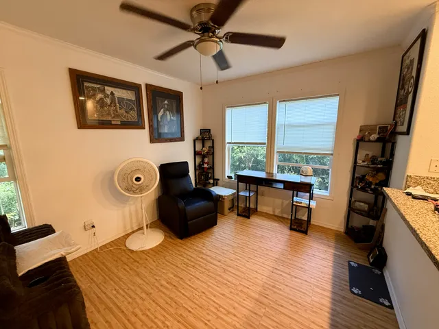 a living room with furniture and a window