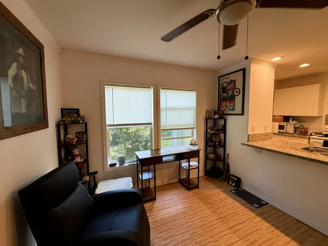 a living room with furniture and a large window