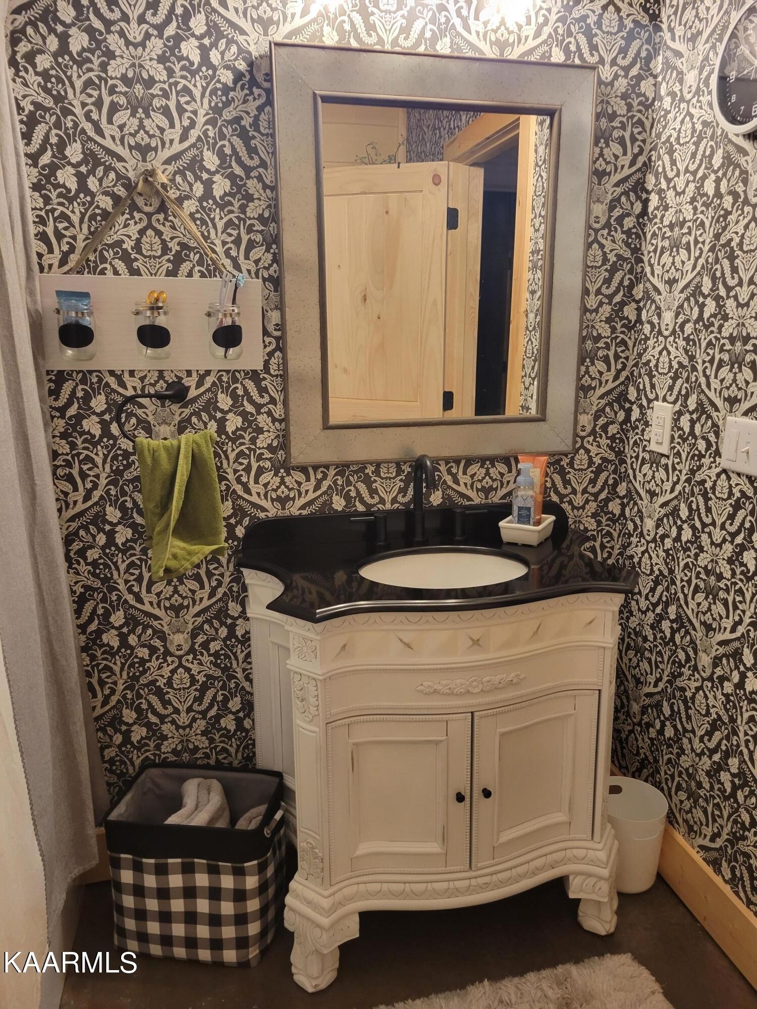 4740 Owl Hole Gap Road Rutledge, TN 37861 - Photo 54 of 58 a bathroom with a sink and a mirror