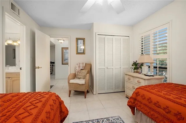 a bedroom with a bed and a cabinets