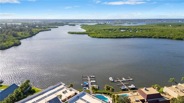 an aerial view of a house with a ocean view