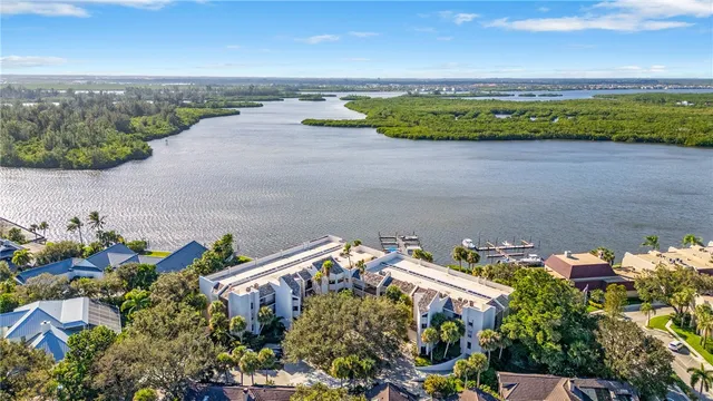an aerial view of a house with a lake view