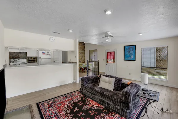 a living room with furniture and a rug