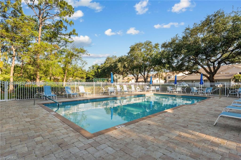 5928 Cranbrook Way, Unit D202 Naples, FL 34112 - Photo 20 of 23 Pool featuring a patio and fence