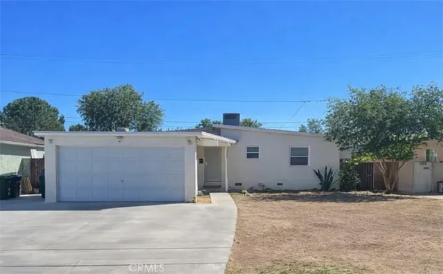 a backyard of a house with plants and trees