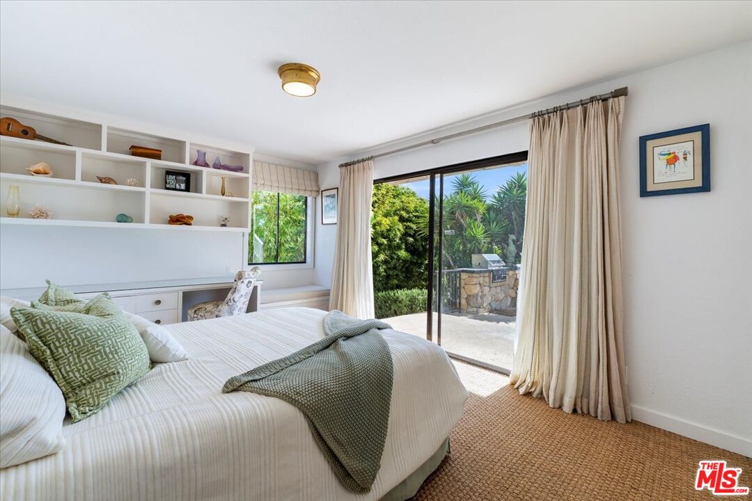 624 Las Alturas Road Santa Barbara, CA 93103 - Photo 15 of 22 a bedroom with a bed and a large window