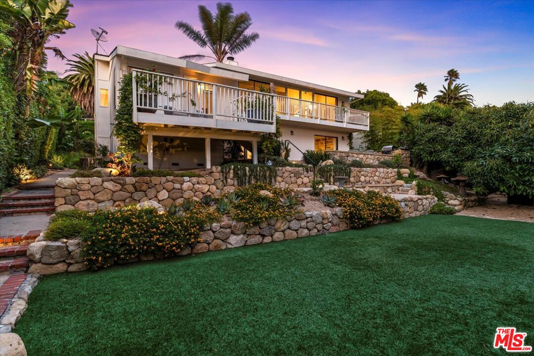 624 Las Alturas Road Santa Barbara, CA 93103 - Photo 20 of 22 a view of a house with a garden